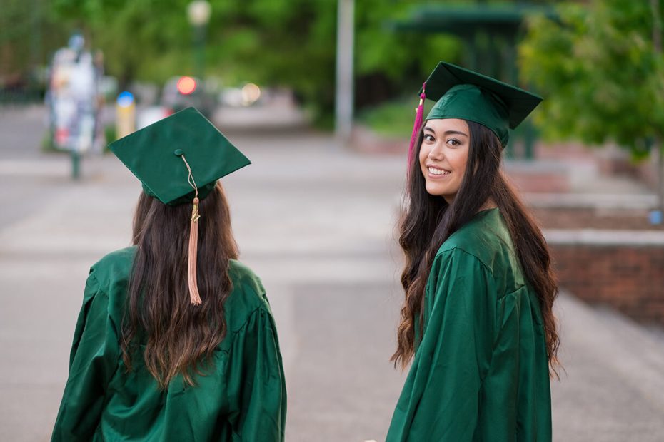 Two women in graduation gowns