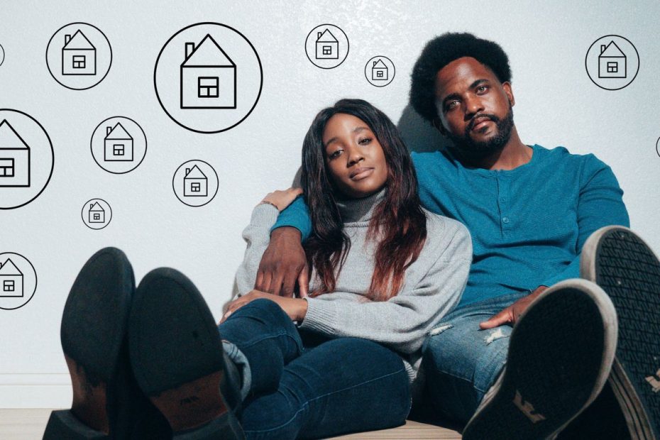 Couple against a wall contemplating home improvements